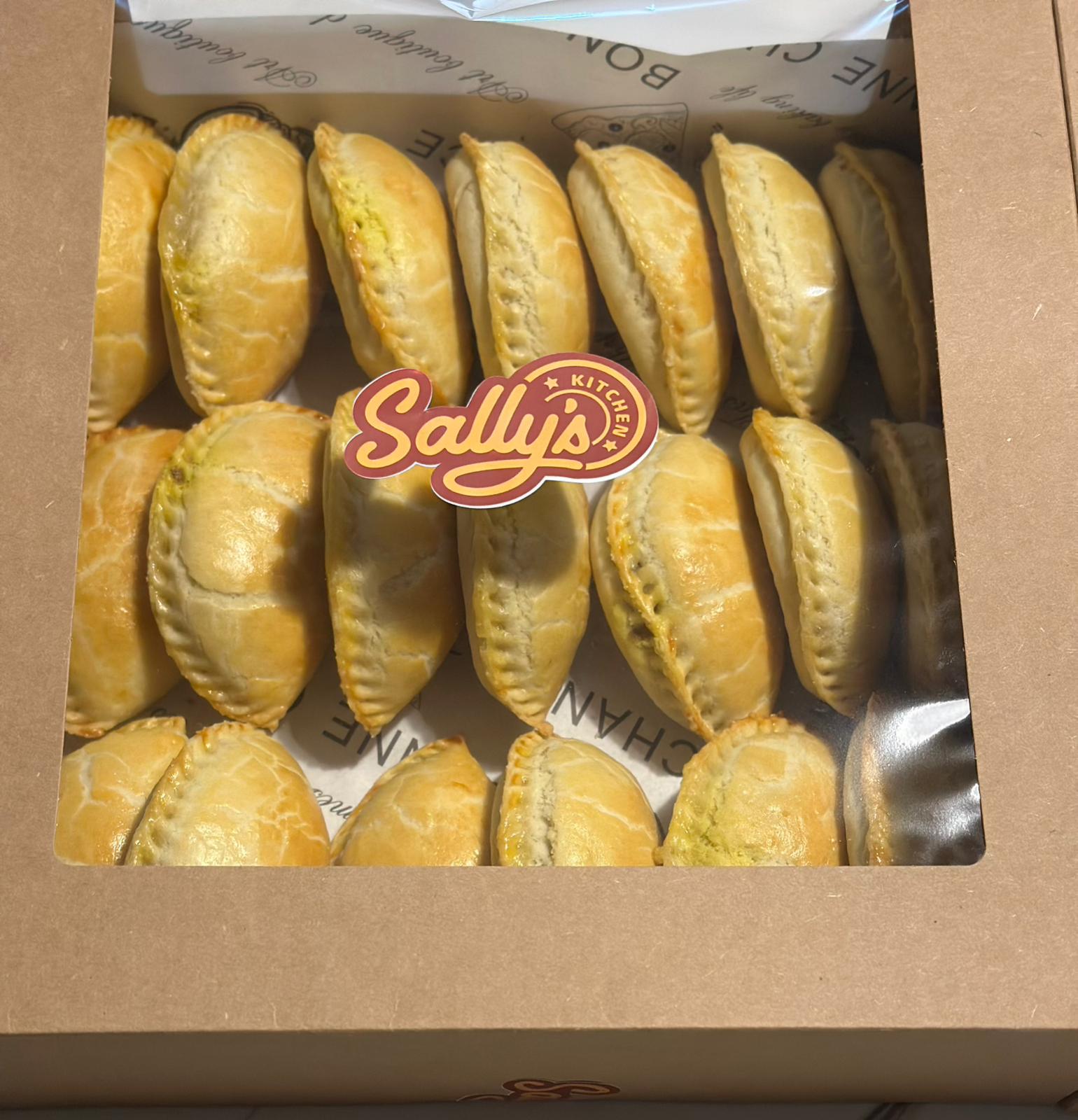 Box of meat pies with Sally's Kitchen logo on a brown background
